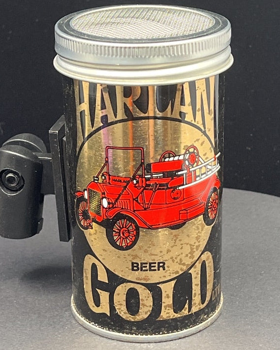 Can-shaped light with Harlan Gold beer label on a black background